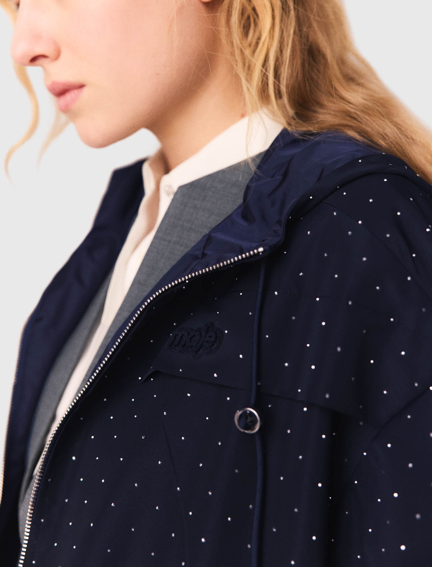 Maje Online / Hooded windbreaker with rhinestones