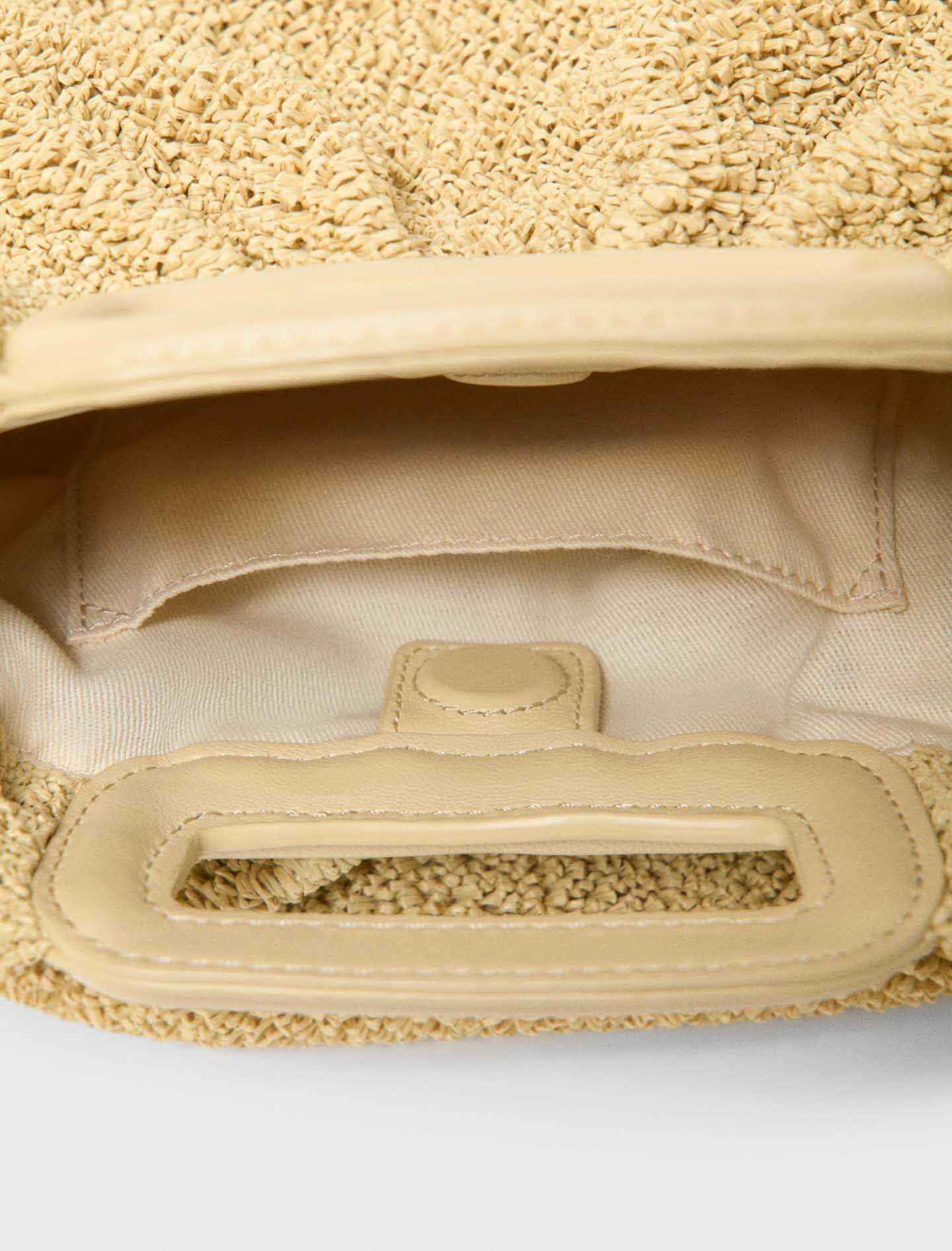 Maje New / Mipli bouclé effect clutch bag