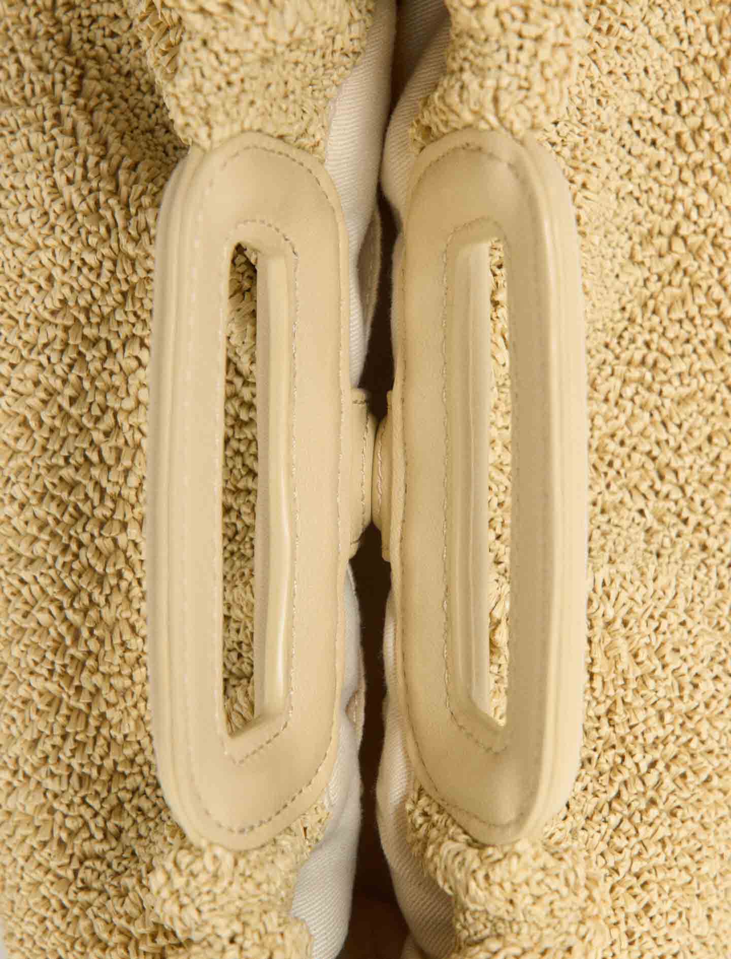 Maje New / Mipli bouclé effect clutch bag